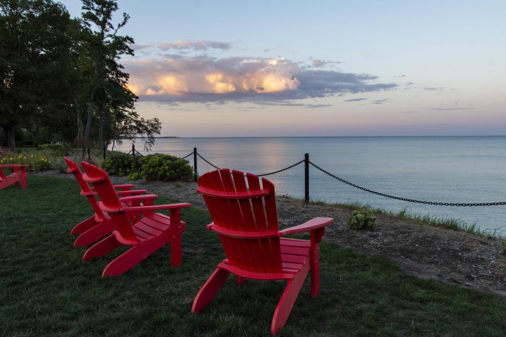 Red chairs along Lake Michigan